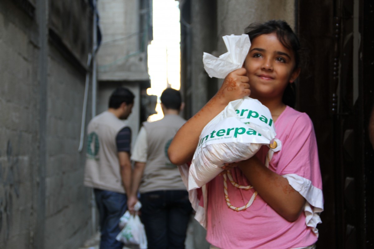 A Palestinian girl receiving Qurbani meat from Interpal