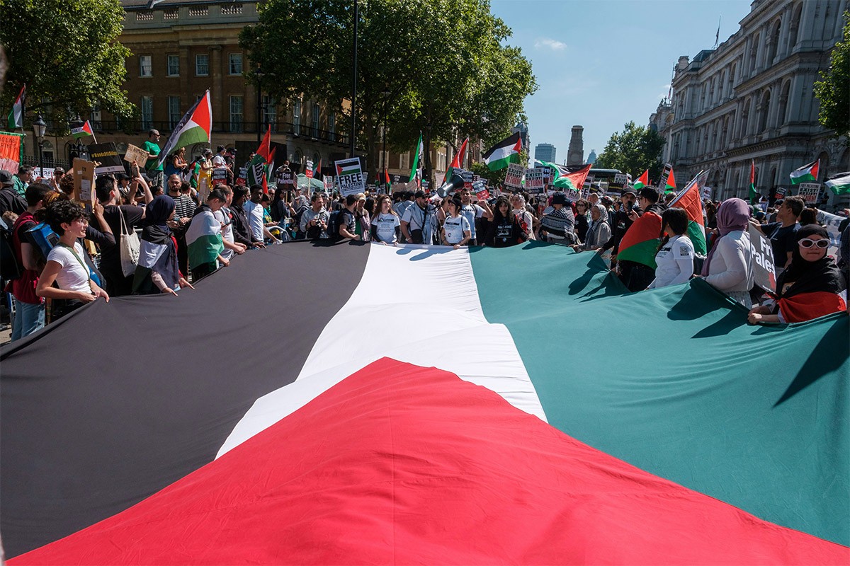 Protestors came out in large to protest in support of Palestine and mourn Journalist Shireen Abu Akleh and the many other journalists who have been killed in action in Palestine over the years [May 16, 2022, Ehimetalor Akhere Unuabona / Unsplash]