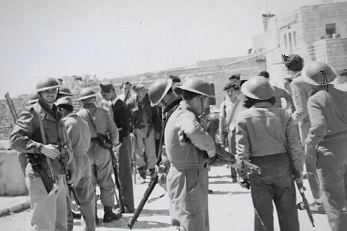 Fighters from Israel's pre-state militia occupying the village of Deir Yassin, April 1948 [IDF archive / Wikimedia]