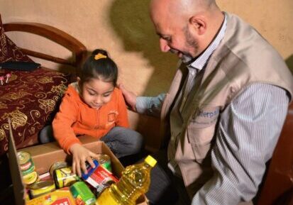 Delivering winter food parcels to Palestinian refugees in Lebanon, December 2014